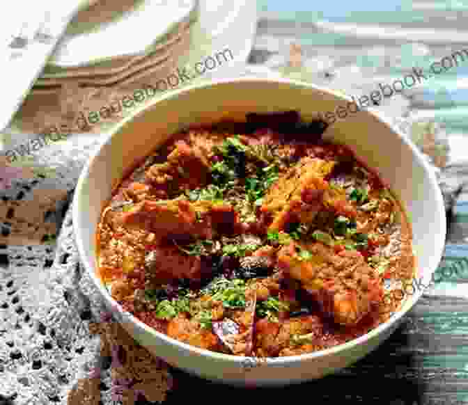 A Tantalizing Plate Of Rogan Josh, A Delectable Kashmiri Lamb Curry Known For Its Rich And Aromatic Flavors. Suzanne S Kashmir: A Magical Journey